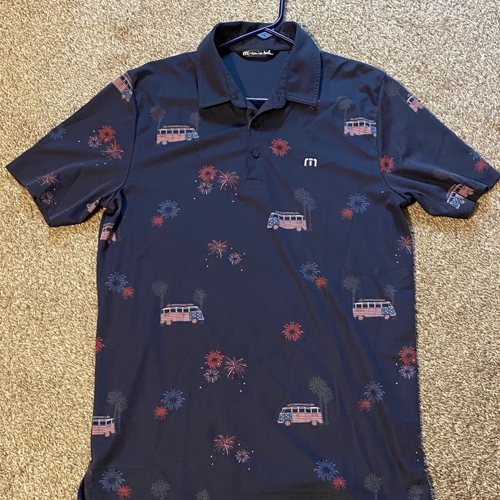 Travis Mathew Navy Polo with Red and Light Blue Accents